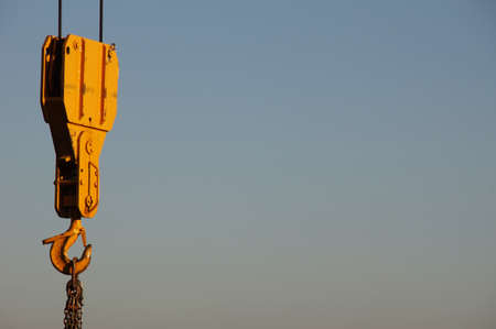 The yellow hook of a craneの写真素材