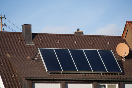 Solar panels on a dormer. the modules are set up even more at an angle in order to be able to...