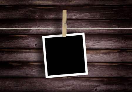 Old Film Blanks Hanging on a Rope Held By Clothespins
Historical photo concept.の写真素材