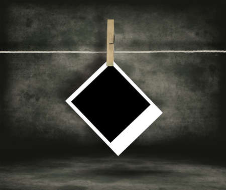 Old Film Blanks Hanging on a Rope Held By Clothespins
Historical photo concept.の写真素材