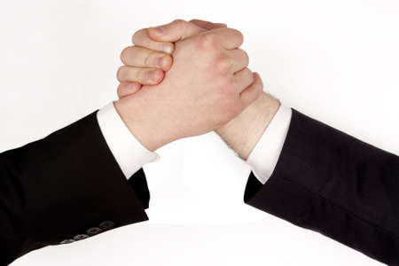 Business man competition... Business rivalry.Two hands, arm wrestling, isolated on white backgroundの写真素材