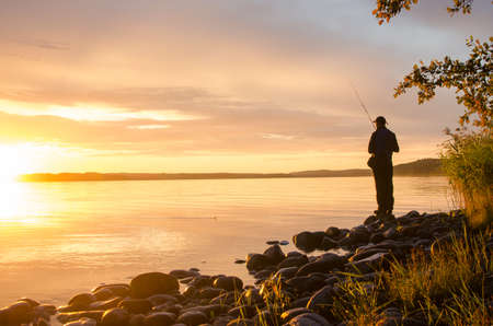 Fishing in the sunsetの写真素材