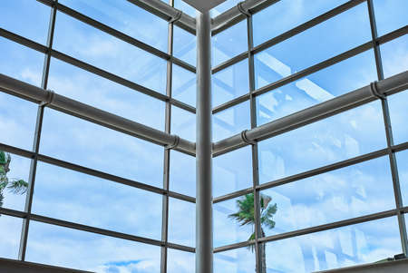 detail of large windows and architectural structure in a large shopping centerの写真素材