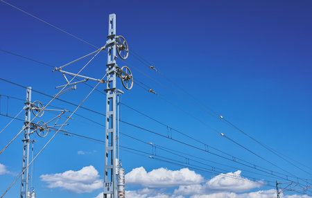 detlle of a metal pole of the catenary of a railway trackの写真素材