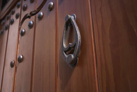knocker on an antique wooden doorの写真素材