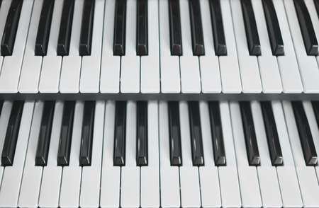 detail of a keyboards, console, pedals of an organ in a churchの写真素材