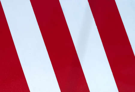 detail of red and white slanted lines indicating no parking of vehiclesの写真素材