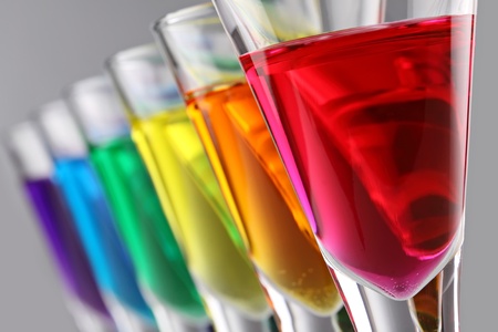 A row of drinks in rainbow coloursの写真素材