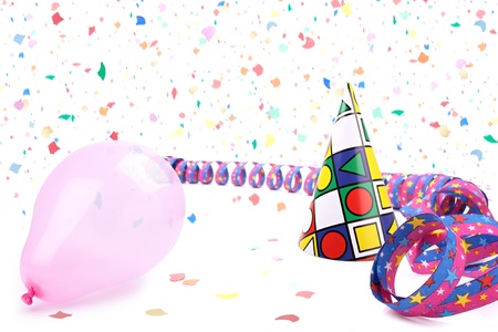Streamer,balloon and party hat in confetti rain.の写真素材