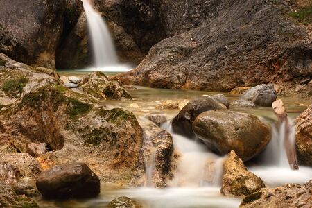 waterfall in a bavarian alpine brookの写真素材
