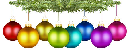 row of colorfull christmas balls on a fir branchの写真素材