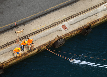 Dockers secure a boat 