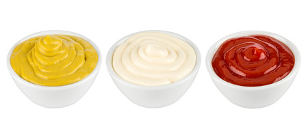 ketchup, mustard and mayonnaise in ceramic bowlesの写真素材