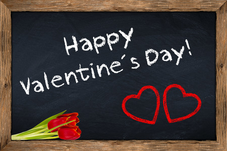valentineÂ´s day blackboard with flowersの写真素材