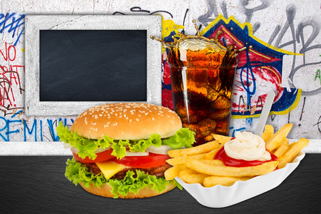 Fast food meal in front of graffiti wallの写真素材
