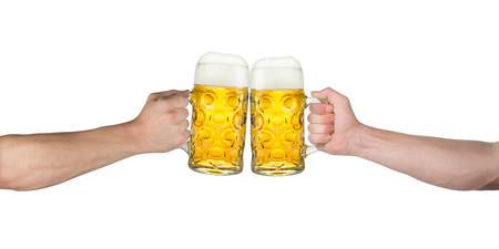 cheers! hands holding up german beer mugsの写真素材