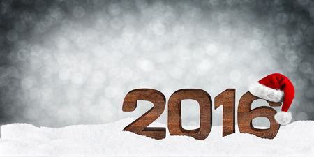 turn of the year concept with wooden numbers and xmas hatの写真素材