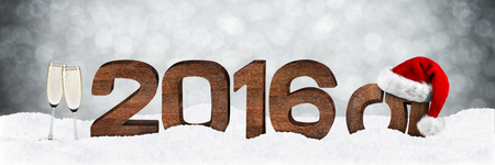 turn of the year concept with wooden numbers and xmas hatの写真素材