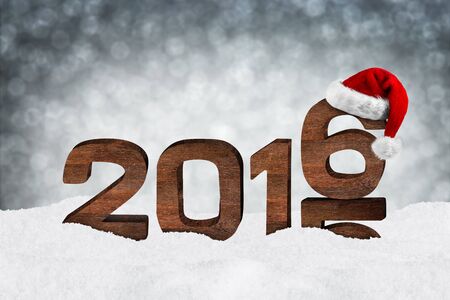turn of the year concept with wooden numbers and xmas hatの写真素材