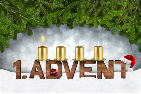 first advent concept with candles and fir branchesの写真素材