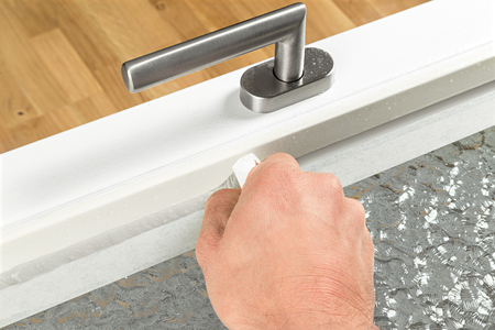 renewing of a silicone joint on a windowの写真素材