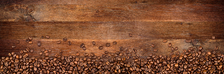 coffee  beans on wide rustic oak background