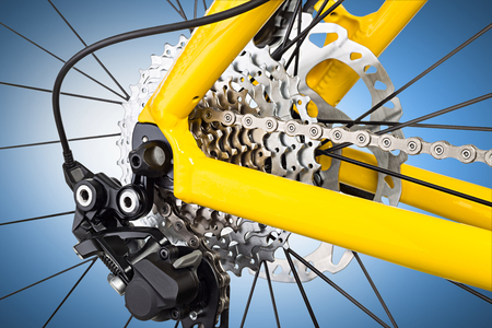 derailleur mechanism closeup on a yellow mountain bikeの写真素材