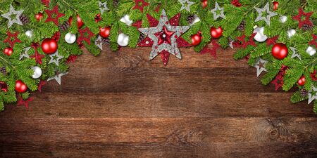 christmas xmas old rustic oak wood background with decoration decorated fir branchesの写真素材