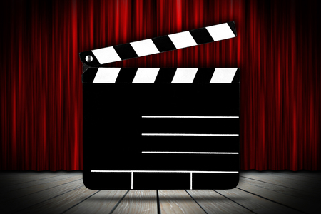cinema voucher pattern with empty blank clapperboard slate on theater stage with red curtainの写真素材