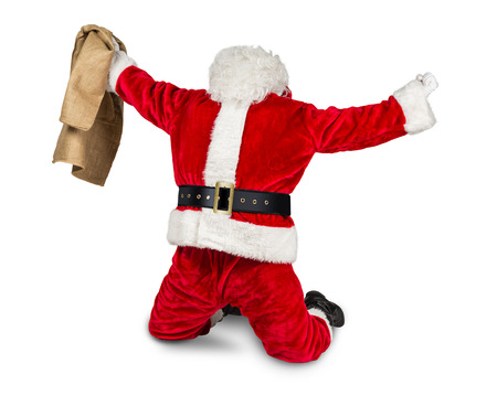 funny crazy hilarious red white santa claus celebration clench fist holding bag in the air job done isolated on white backgroundの写真素材
