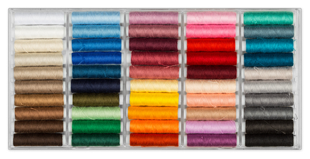 box with colorful sewing cottons spools isolated on white backgroundの写真素材