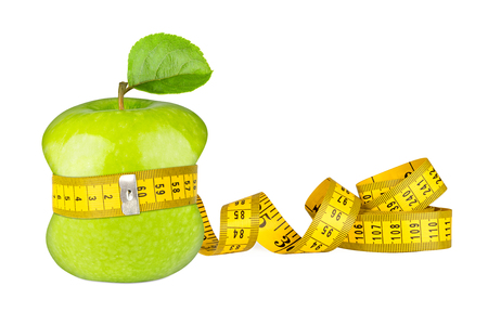green apple with yellow measuring tape fitness diet concept isolated white backgroundの写真素材