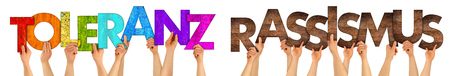 translation Toleranz Rassismus / tolerance racism hands holding up colorful wood letter isolated on white background tolerance refugee conceptの写真素材