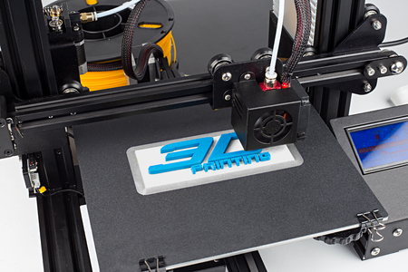 3d print of printer printing logo symbol lettering with white blue pla filament modern future technology concept backgroundの写真素材