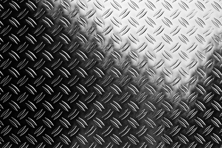 shiny polished aluminum new diamond plate metal texture background empty with copy space design pattern backgroundの写真素材