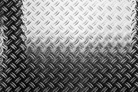 shiny polished aluminum new diamond plate metal texture background empty with copy space design pattern backgroundの写真素材