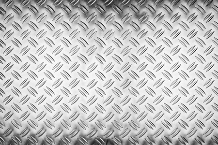 shiny polished aluminum new diamond plate metal texture background empty with copy space design pattern backgroundの写真素材
