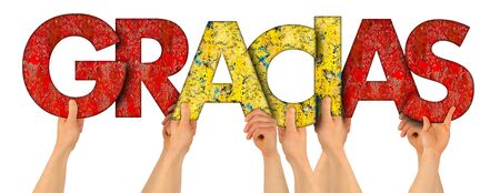 people holding up colorful red yellow spain flag wooden letter with spanish word gracias ( english translation: thank you ) isolated on white background.  thankful grateful respect rewarding conceptの写真素材