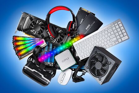 pc computer hardware components electronics collage. cpu micro processor graphics card power supply ddr ram headset vr glasses solid state ssd hard drive mouse and keyboard on blue white backgroundの写真素材