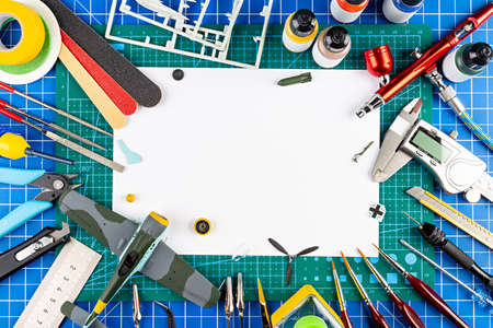 desktop view from above of assembly painting of retro scale model plane concept copy space...
