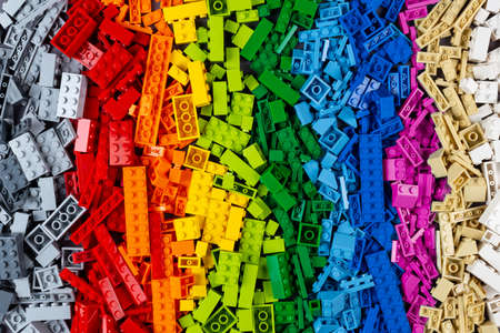 top view of pile of many various colorful rainbow colored stackable plastic toy bricks. childhood education development conceptの写真素材