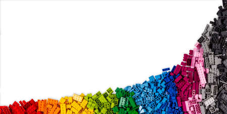 stackable plastic toy bricks in top view. Colorful texture childhood education and development concept background.の写真素材