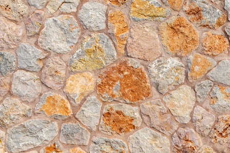 texture pattern background of colorful exterior naural stone wallの写真素材