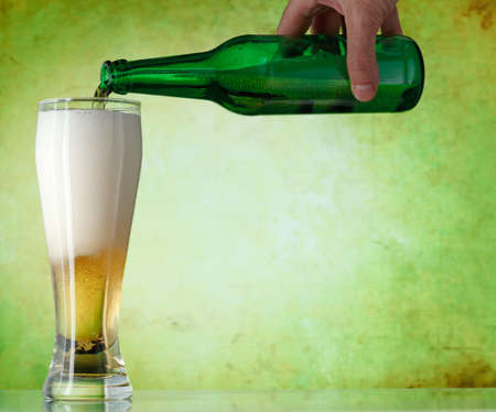 A beer being poured into a glassの写真素材