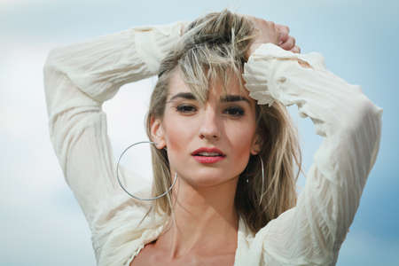 Sexy young woman sky backgroundの写真素材