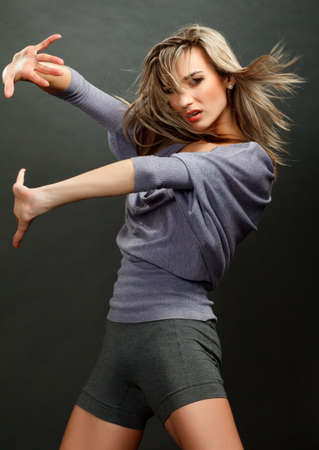 Portrait of a beautiful girl with flying blond hair の写真素材