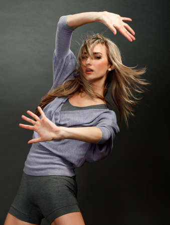 Portrait of a beautiful girl with flying blond hair 
