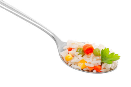 Rice with vegetables in a spoonの写真素材