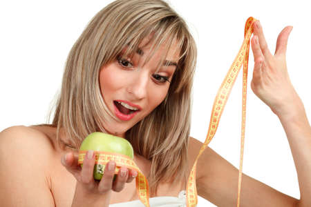 woman holding an apple on a white backgroundの写真素材