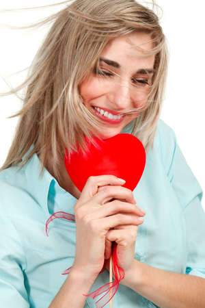 attractive smiling woman with heart on white background の写真素材